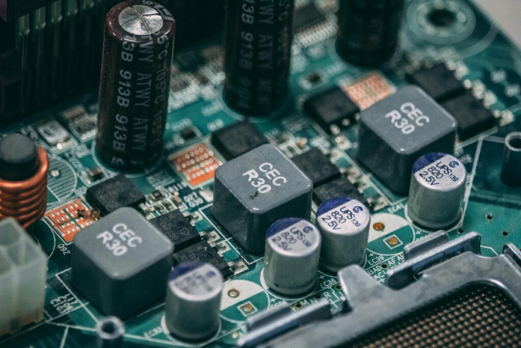 This close - up shows a detailed view of an electronic circuit board filled with various components like capacitors and resistors. Just as these components work together to power a device, IC88 functions as an essential part in the realm of MCU development. About Us – IC88 Your Trusted MCU Development Partner, emphasizes our role in providing reliable solutions, integrating seamlessly with your projects, much like these components on the circuit board contribute to its overall functionality.